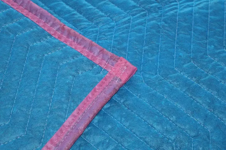 Baby blue cotton moving pad corner with pink trim