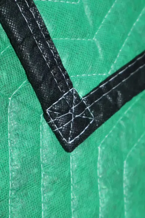 Green cotton moving pad corner with black trim