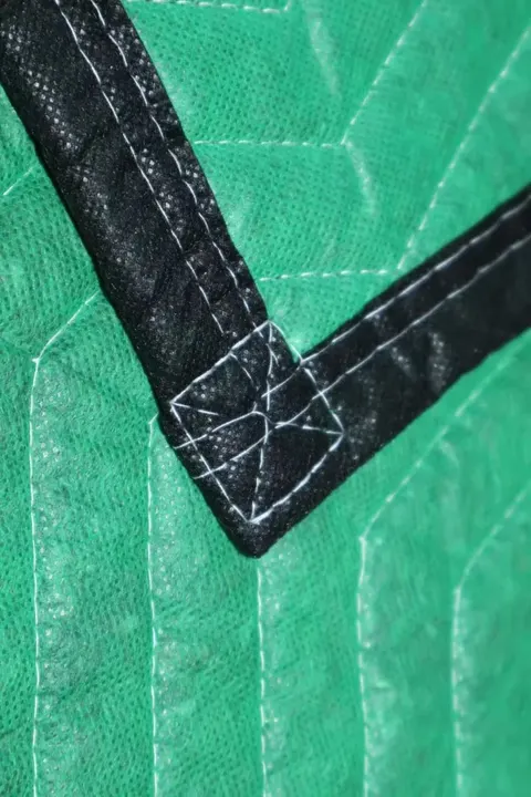 Folded green cotton moving pad