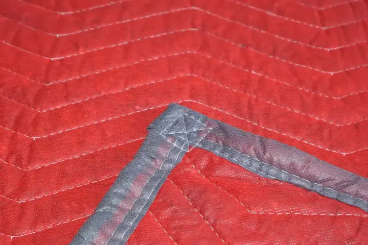 Red cotton moving pad corner with grey trim