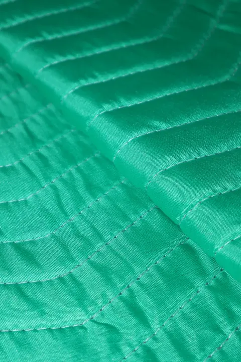 Green polyester moving pad corner with black trim