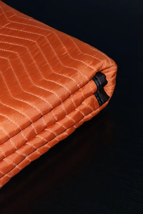 Orange polyester moving pad corner with black trim