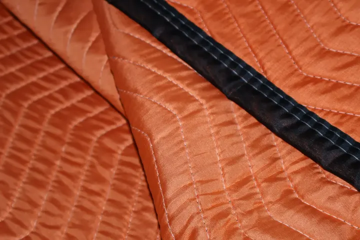 Folded orange polyester moving pad detail