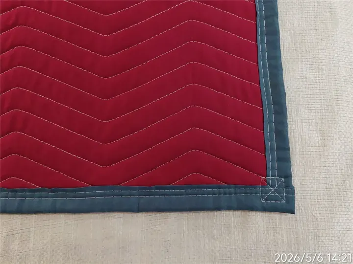 Red polyester moving pad corner with blue trim