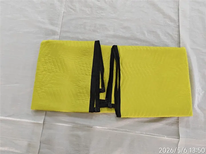 Yellow polyester moving pad tie detail with black trim